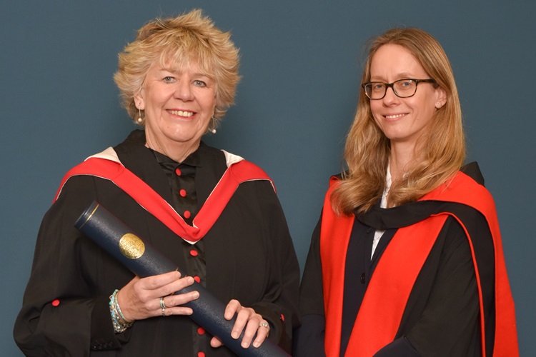 The Rt Hon Lady Dorrian PC KC FRSE holding her degree, with Dr Mateja Peter